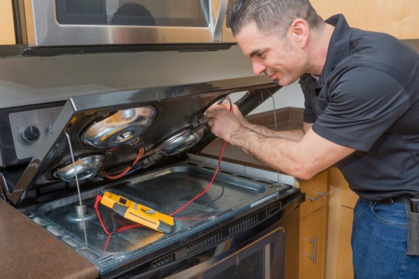 repairman opening kitchen range md 600x400 1